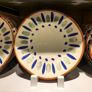 A group of three plates sitting on top of a counter